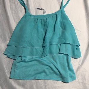 A flowy light turquoise shirt